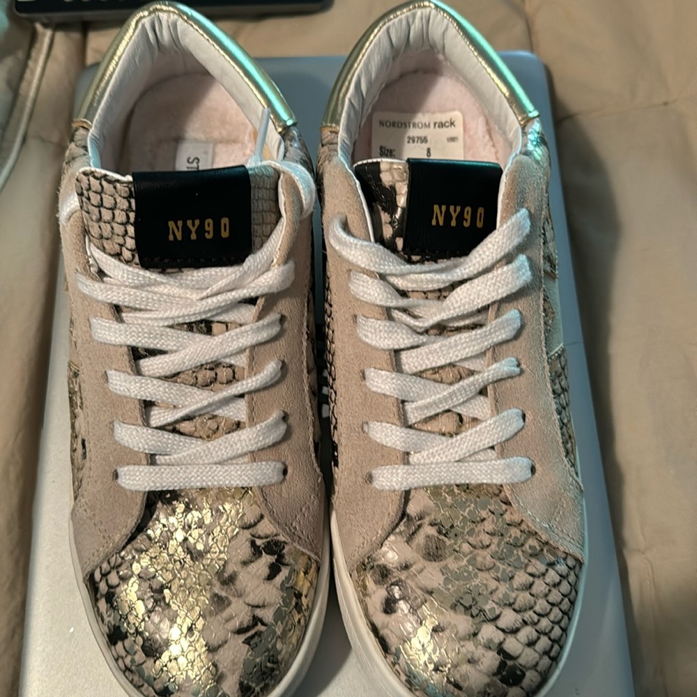 Steve Madden gold snake skin pattern shoe.